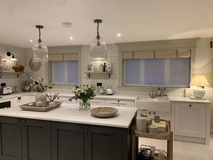 Striped Roman blind in a white rustic kitchen,  neutral with grey French stripes